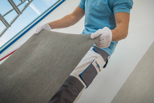 istock Worker Preparing Piece of Wall Vinyl Wallpaper 1364131876