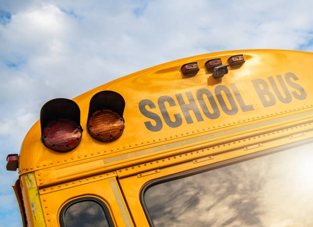 American School Bus Close Up American School Bus Regularly Used to Transport Students to and From School. Transportation Industry. empty school bus stock pictures, royalty-free photos & images