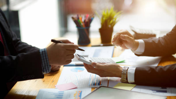 istock Executive manager managing project budget report with his colleagues 1364132951