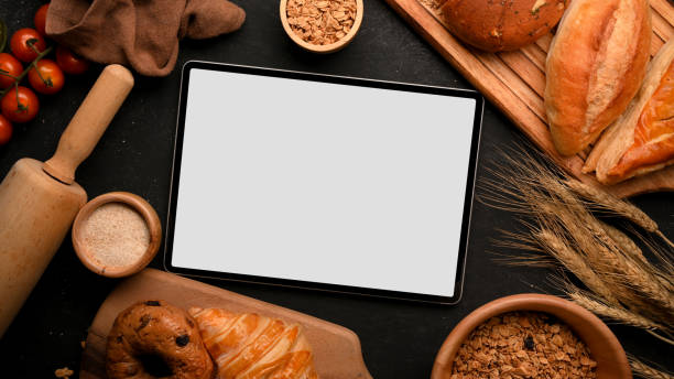 istock A mockup of digital tablet blank screen on a bakery pastry tabletop. 1364135430
