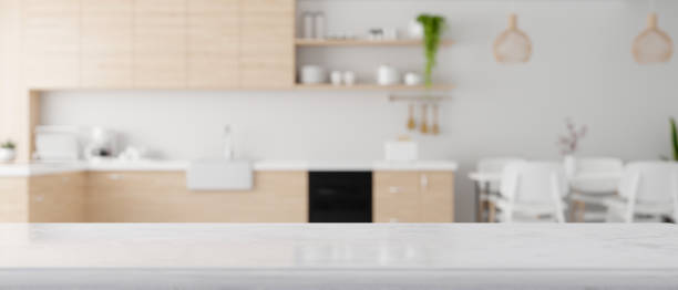istock White granite kitchen countertop over modern Scandinavian kitchen background. 1364135522