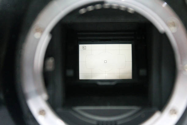 istock front view of dslr digital camera without body cap showing the mirror and camera sensor, defocused open old dslr digital camera 1364136574