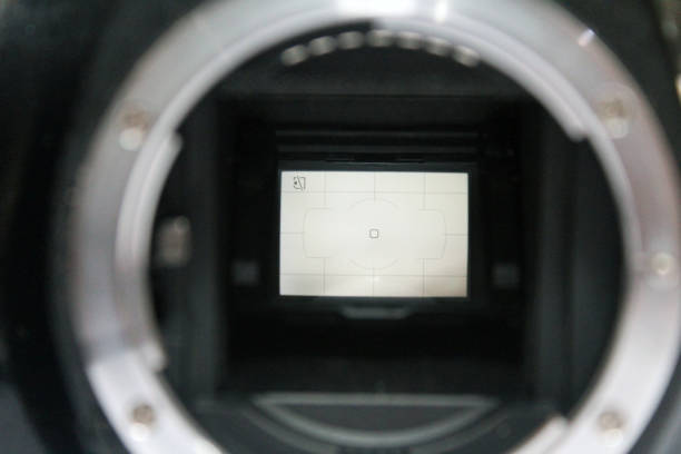 istock front view of dslr digital camera without body cap showing the mirror and camera sensor, defocused open old dslr digital camera 1364136594