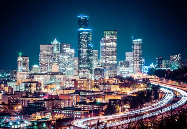 istock seattle cityscape at night with traffic light. 1364138262