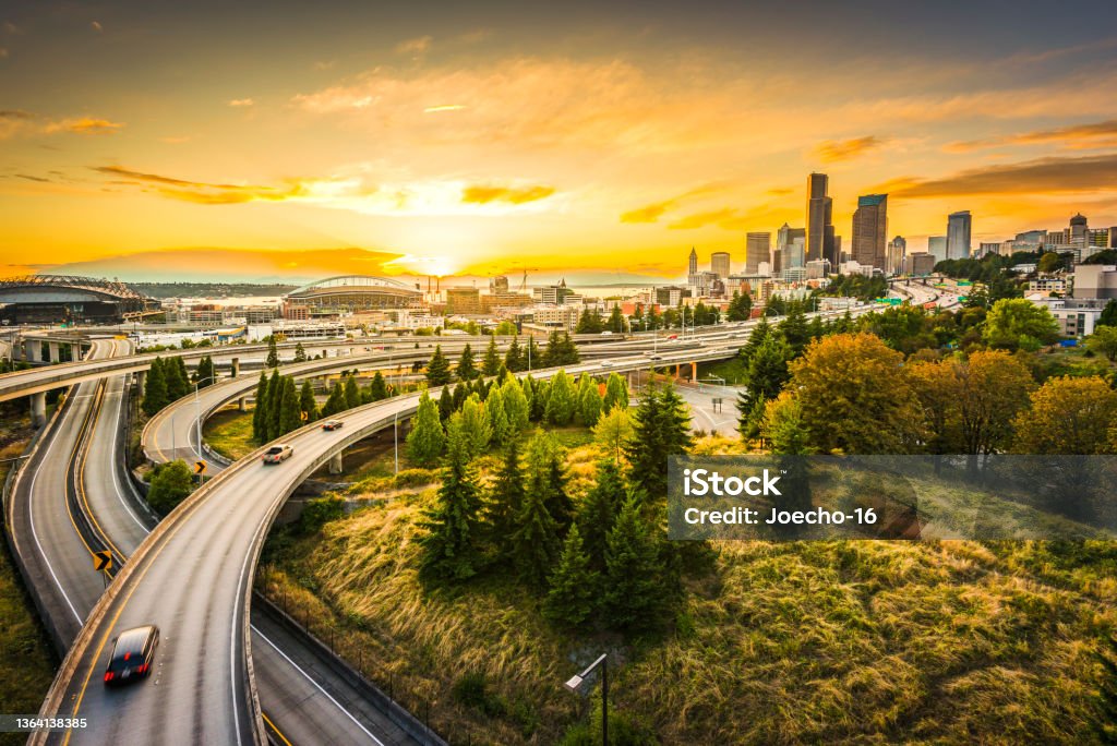 Seattle skylines and Interstate freeways converge at sunset, Seattle, Washington, USA. Seattle Stock Photo