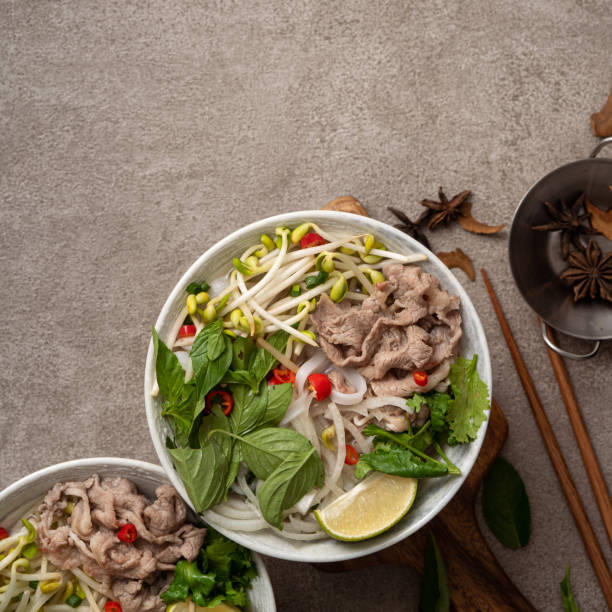 istock Delicious vietnamese beef noodles pho with ingredients. 1364142876