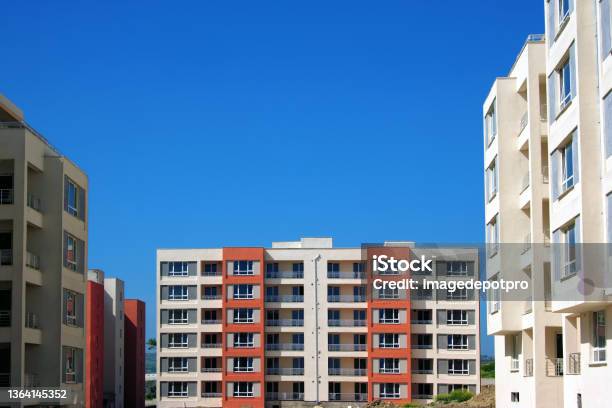 Construction Industry And Incomplete Residential Apartment Buildings In Construction Site Stock Photo - Download Image Now