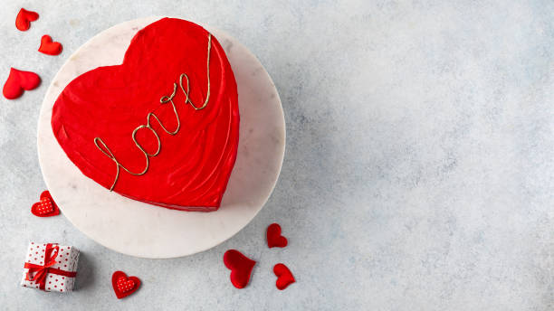 Red cake for St. Valentine's Day, Mother's Day, or Birthday on light table stock photo