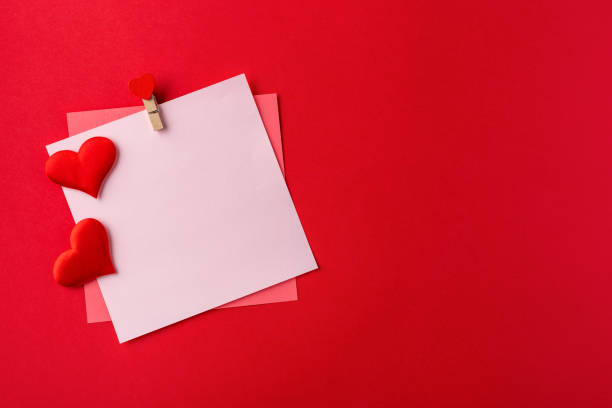 istock Mockup blank greeting card for valentines day. Composition with red hearts for Valentine's Day on red background. Flat lay. Love and relationships concept. 1364145595