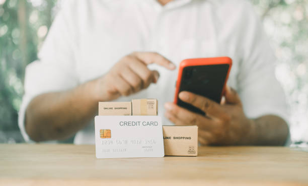 istock Man using mobile smart phone making internet payment for online shopping via mobile banking app. 1364145732