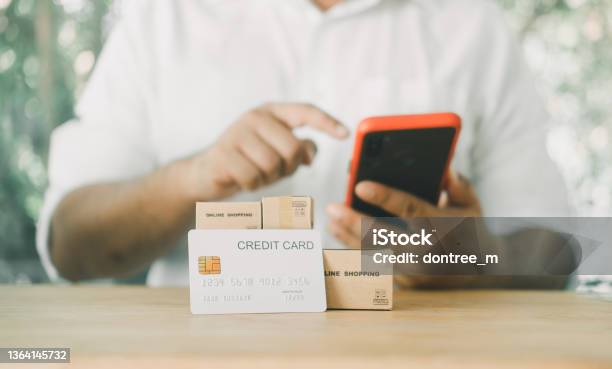 Man Using Mobile Smart Phone Making Internet Payment For Online Shopping Via Mobile Banking App Stock Photo - Download Image Now