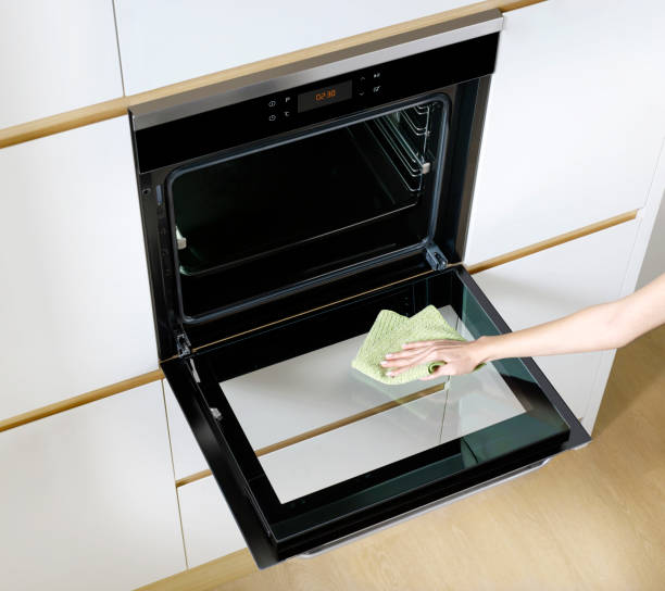 Cleaning oven stock photo