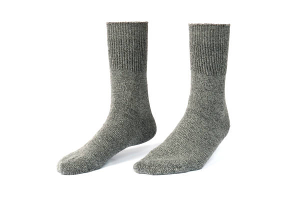 istock gray socks isolated on white background. mock up design of blank socks. 1364146487
