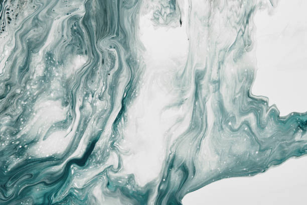 istock Fluid Art. Liquid transparent white and green abstract paint drips and wave. Marble effect background or texture 1364146577
