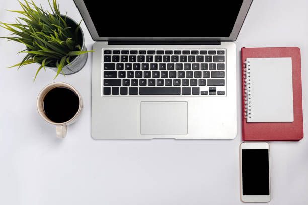 istock Laptop and note book with a mobile phone 1364146580