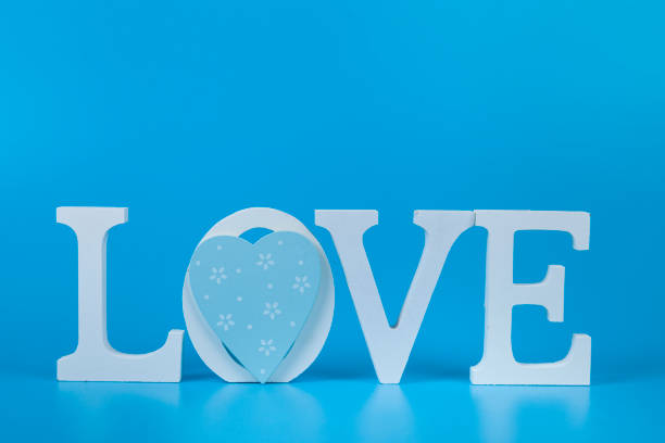 istock Word Love and heart on a blue background. 1364147236