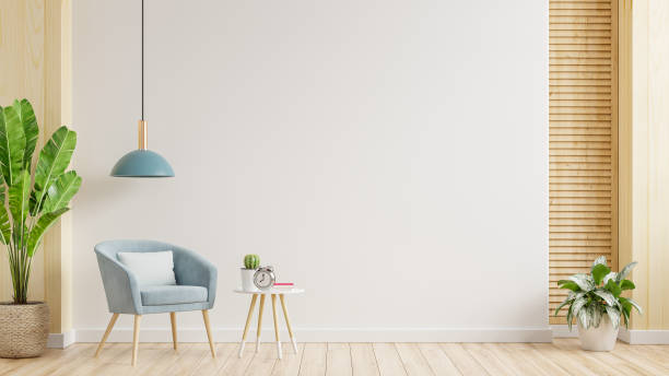 istock Modern minimalist interior with an armchair on empty white wall background. 1364148335