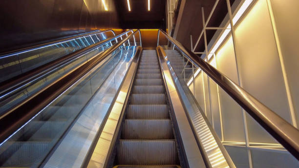 istock Moving escalator in the business center. Escalator. Empty escalator 1364153611