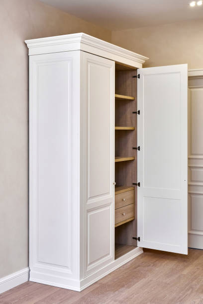 istock White vintage wardrobe with crown moldings and open facade 1364153933