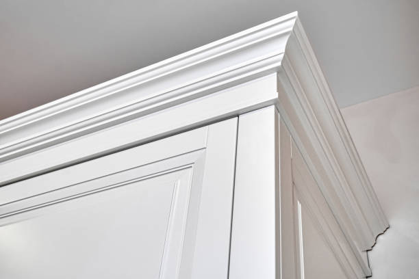 istock Elegant white vintage wardrobe cabinet with crown moldings 1364154010