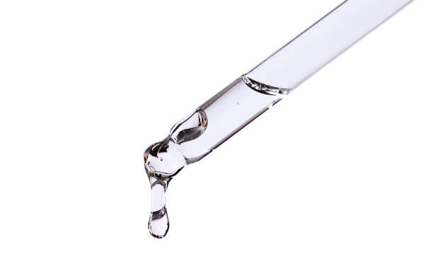 istock pipette with serum on white background isolated with falling drop 1364157192