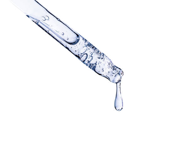 istock pipette with serum on white background isolated with falling drop 1364157206