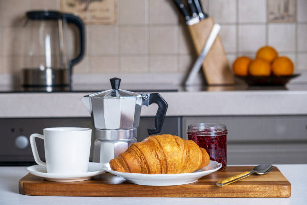 istock Serve on serving board with coffee, French croissant and jam 1364157542