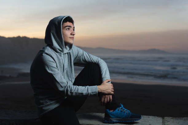 istock Thoughtful hispanic teenager at seaside 1364160422