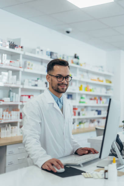 istock Portrait of a handsome pharmacist working in a pharmacy 1364160468