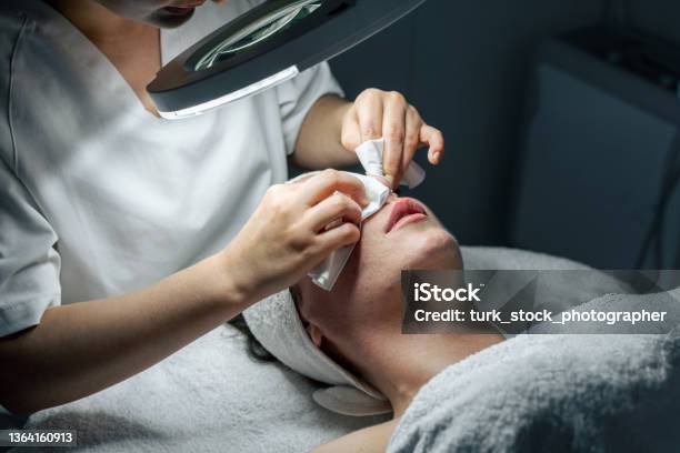 Dermatologist Doing Facial Care Against Acnes Stock Photo - Download Image Now - Removing, Beauty Spa, Blackhead