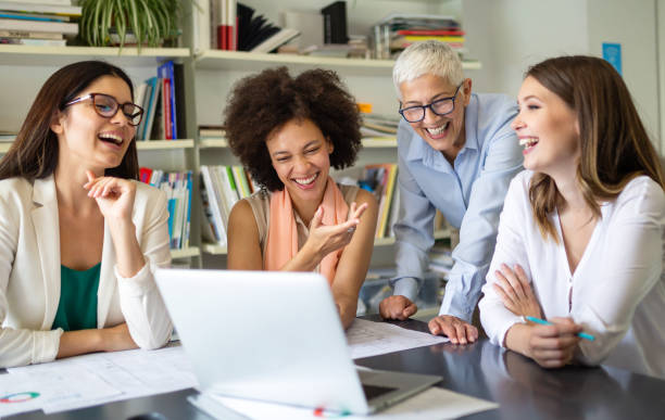 Group of happy business people working together on new project in corporate office. stock photo