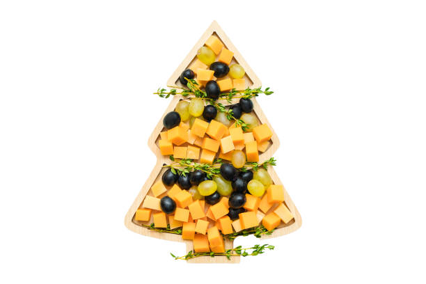 istock Festive table with a cheese plate in the form of a Christmas tree 1364165837