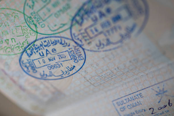 Travel, Tourism, Immigration - Close up image of a passport page containing several immigration stamps
