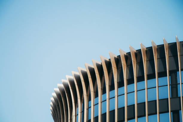 istock Empty and clean buildings outside tall buildings under blue sky 1364168089