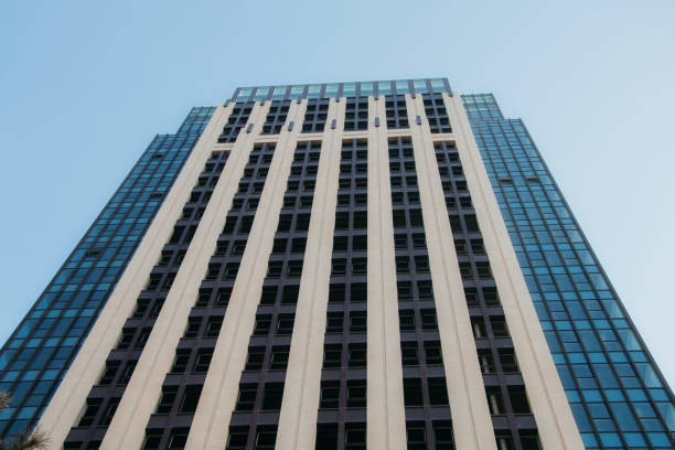 istock Empty and clean buildings outside tall buildings under blue sky 1364168090