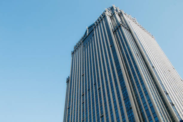 istock Empty and clean buildings outside tall buildings under blue sky 1364168116