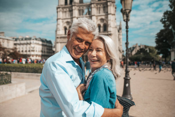 Senior couple in vacation, spending their holidays visiting the beautiful city of Paris, France.