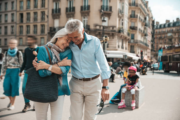 istock Seniors taking a break in Paris relaxing by the Seine River in Paris 1364169231
