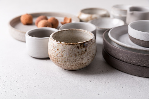 Ceramic tableware, empty craft ceramic. Clay plates and cups.