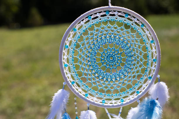 istock Handmade dream catcher with feathers threads and beads rope hanging 1364171987