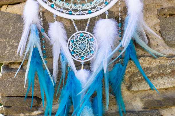 istock Handmade dream catcher with feathers threads and beads rope hanging 1364171994
