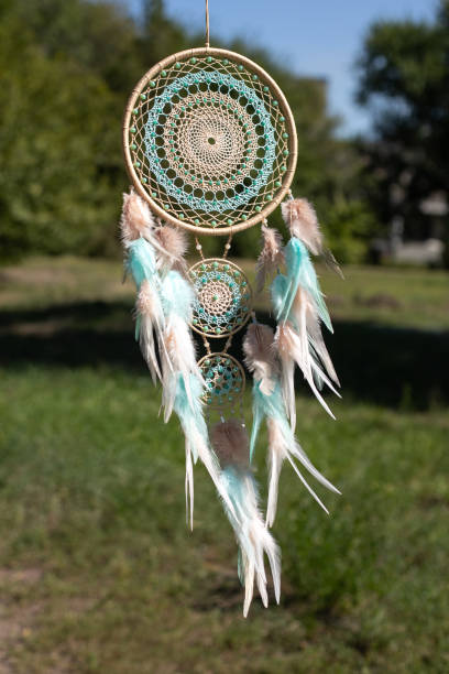 istock Handmade dream catcher with feathers threads and beads rope hanging 1364171995