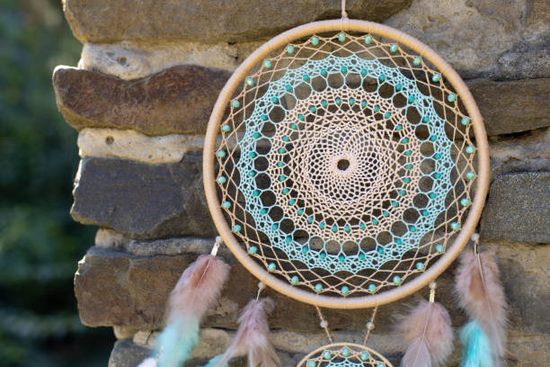 istock Handmade dream catcher with feathers threads and beads rope hanging 1364172004