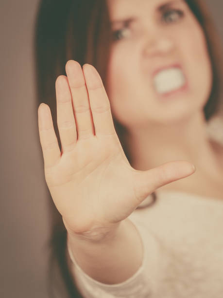 istock Angry apodicticity woman showing stop with hand 1364172024