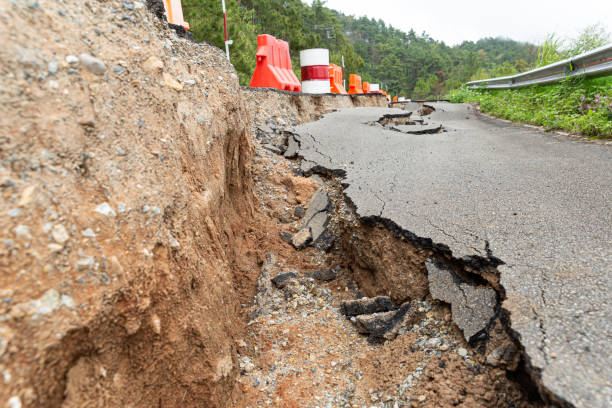 istock The paved road collapsed into cracks after the earthquake, non-standard construction. 1364172461