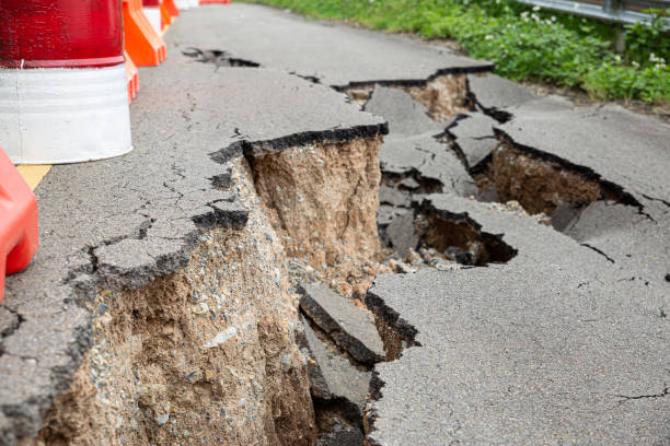 istock The paved road collapsed into cracks after the earthquake, non-standard construction. 1364172474