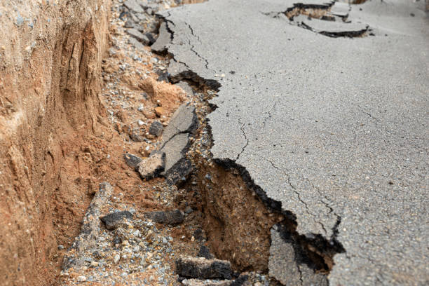 istock The paved road collapsed into cracks after the earthquake, non-standard construction. 1364172499