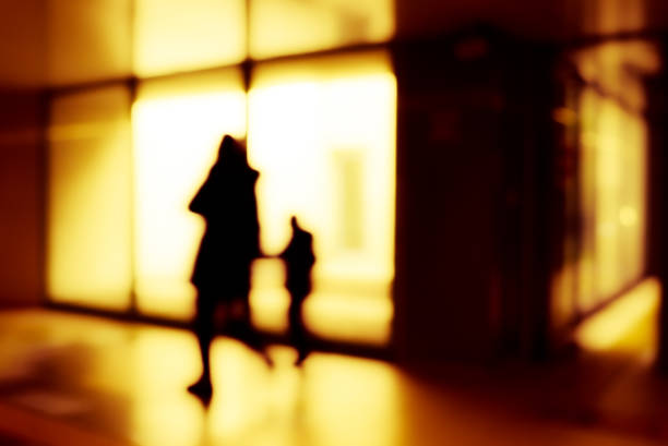 Passengers at O'Hare International Airport make there way to their planes.  neon lights.