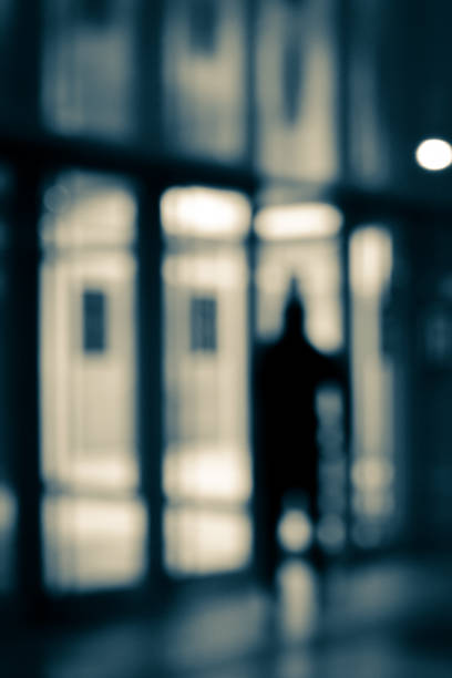istock Blurry human silhouette in a subway. Moving human silhouettes in blur. 1364172733