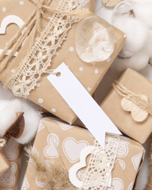 istock Valentines present with blank gift tag and heart close up, Rustic label Mockup 1364172769